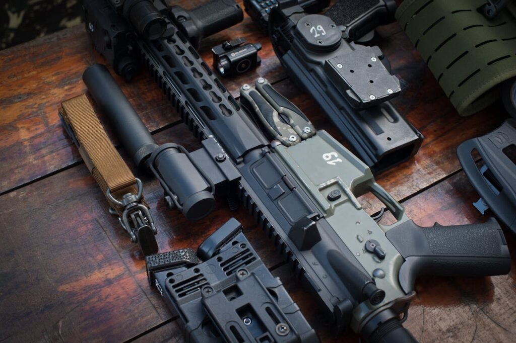 Close-Up Shot of Firearms on Wooden Surface